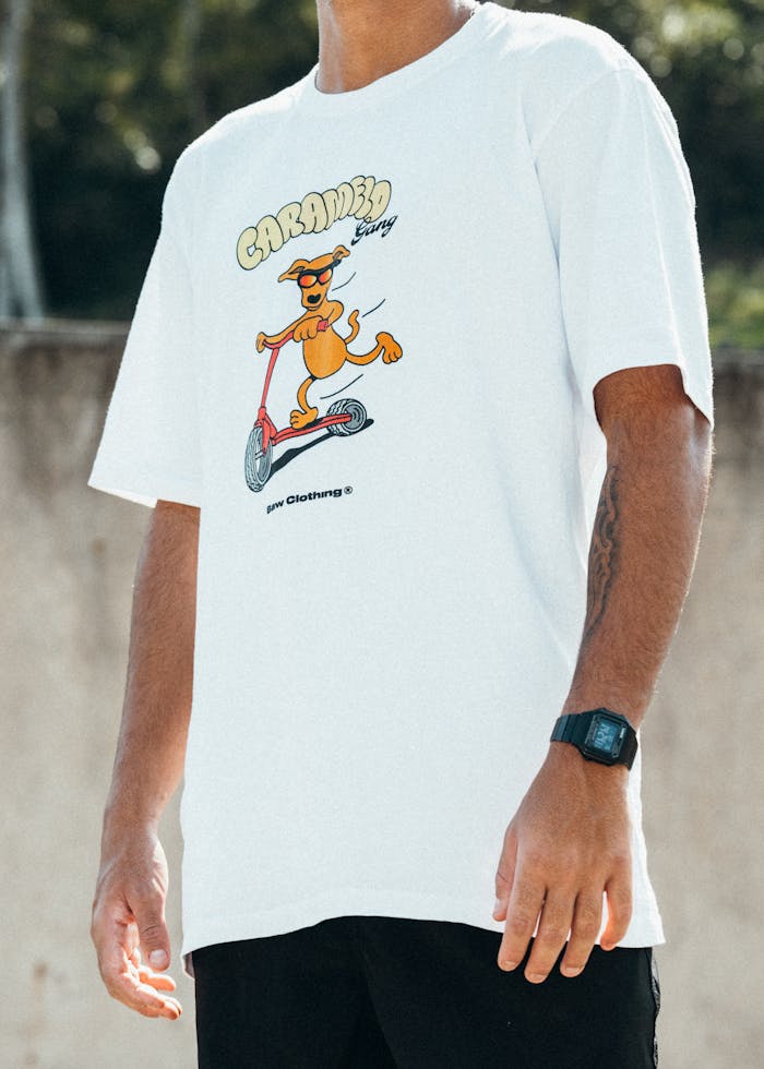 Man wearing a fun cartoon graphic t-shirt, perfect for casual style and streetwear lovers.